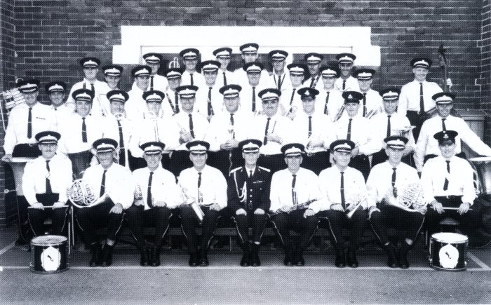 https://police.freom.com/post-war-years/ Redfern - 1966: NSW Police Band at Redfern Police Academy – March 1966 (click to enlarge) FRONT ROW: L – R: Lindsay Chate, Fred Gregory, Ron Webb, Bill Brown, George Jackson, Lofty Sharp, Arthur Wilson, Rex Waddington, Bruce Constable. 2nd ROW L – R: Max Gruggen, Peter Williams, Harry Salter, Graeme Bates, Bill Martin, Ken Mills, Bill Lewis, Barry Grove-Jones, Max Hammond, Gordon Crompton, Ron Cawthray. 3rd ROW L – R: Ben Acton, Jack Nicholson, Darcy Hay, Jack Williams, Mason Brockie, Neville Trevelyan, Alf Ewards, Dennis Williams, Alan Hines, John Corbett, Ron Morris. 4th ROW L – R: Lloyd Turnbull, Les Lambert, Hugh Barnwell, Alan Gallagher, Bill Halford, Bill Beaver, Don Lewis