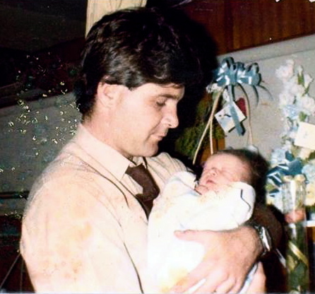 Steve Tier holding his son, Joshua Tier.