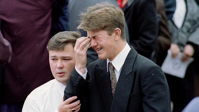 http://www.dailytelegraph.com.au/news/crescent-heads-police-killings-two-decades-on-ceremony-will-mark-sacrifice-made-by-senior-constables-on-duty/story-fni0cx4q-1227433992584 Glen Addison weeps as his brother Scott consoles him at their father's funeral.