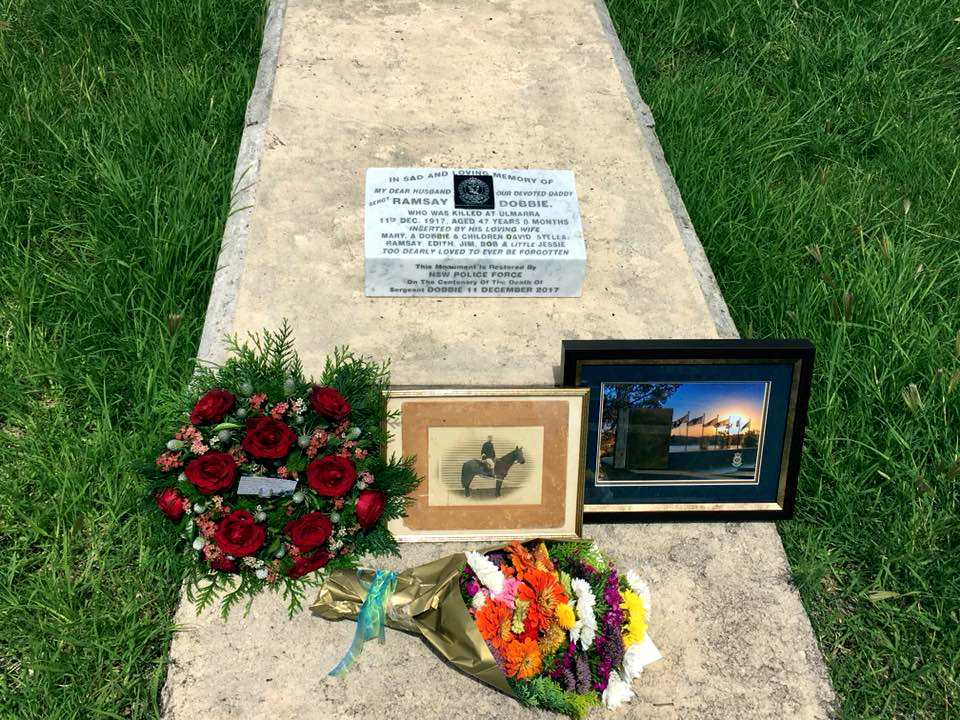 Inscription: In sad and loving memory of my dear husband our devoted daddy Sergt Ramsay Dobbie. Who was killed at Ulmarra 11th Dec. 1917, aged 47 years 8 months. Inserted by his loving wife Mary A. Dobbie & children David, Stella, Ramsay, Edith, Jim, Bob & little Jessie. Too dearly loved to ever be forgotten. This monument is restored by NSW Police Force on the Centerary of the death of Sergeant Dobbie 11 December 2017