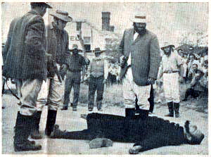 Scan of photo from The Canberra Times of the re-enactment at the 100th anniversary of the shooting of Constable Nelson (played by Edgar Penzig) by bushranger John Dunn (played by Chris Woodland) on January 26, 1965. (Photo: Courtesy Chris Woodland) Collector re-enactment 2 CT.jpg Photo: Chris Woodland