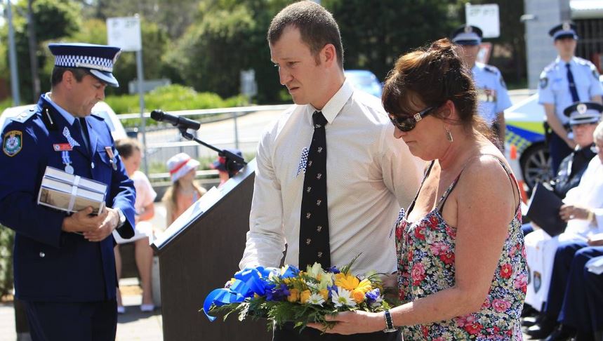 http://www.illawarramercury.com.au/story/2591540/lake-illawarra-officers-honoured-on-police-remembrance-day-photos/#slide=11 Family members lay a wreath for Det Const Stephen John Tier. Picture: ANDY ZAKELI