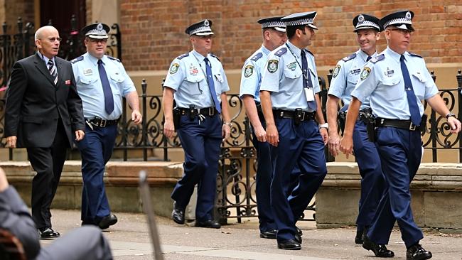 http://www.dailytelegraph.com.au/news/nsw/mitchell-barbieri-and-his-mother-fiona-plead-guilty-to-their-roles-in-killing-of-decorated-officer-bryson-anderson/story-fni0cx12-1227113230357 Police officers arrive for the trial for Fiona and Mitchell Barbieri charged with the murder of Inspector Bryson Anderson. They pleaded guilty to their roles in his death at the start of the trial this morning. Picture: John Grainger
