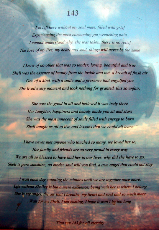 WEDNESDAY 27 JULY 2005 MEMORIAL SITE AT THE TREE AGAINST WHICH CONSTABLE SHELLEY DAVIS, FROM GOULBURN POLICE STATION, LOST HER LIFE ONE NIGHT WHEN THE POLICE SEDAN SHE WAS A PASSENGER IN SLAMMED SIDEWAYS INTO THIS TREE - KILLING SHELLEY. THIS IS A HUGE TRIBUTE. I FOUND A 20 CENT PIECE ON THE GROUND AT THE BASE OF THE TREE. IT WAS COVERED IN BROWN (DRY BLOOD) AND WOULD HAVE OBVIOUSLY COME FROM THE CAR AND POSSIBLY BELONGED TO ONE OF THE OCCUPANTS.IT WAS RAINING ON THE NIGHT OF THIS ACCIDENT. SOMETIME IN 2010, THIS TREE AND THE GIFTS WERE TOTALLY REMOVED FROM THIS LOCATION. A 'STONE' MEMORIAL, WITH PLAQUE, WAS LATER LAID IN THE CAR PARK ADJACENT TO THIS TREE. I DON'T KNOW WHAT HAS BECOME OF THE PHOTOS, PRAYERS ETC BUT THE TREE HAS BEEN TOTALLY REMOVED FROM THE LOCATION ALSO.