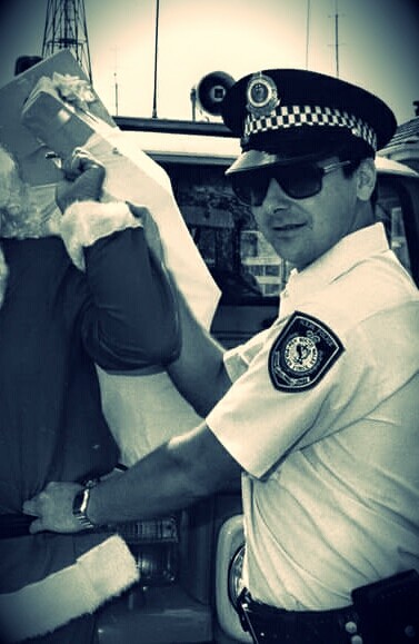 Constable Gary Dunningham arresting Santa Claus
