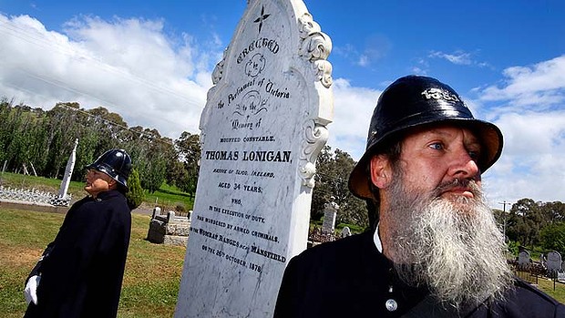 In memorial: Two members of the Victoria Police Historical Society stand at the restored grave of Constable Thomas Lonigan. Photo: Angela Wylie Read more: http://www.theage.com.au/victoria/kelly-victims-will-not-be-forgotten-say-descendents-20131024-2w3y5.html#ixzz30fvGCDzc Thomas LONIGAN - VicPol - Murdered - Oct1878 - Grave 1