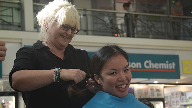 Constable Cheryl Leung had her chest-length hair shaved off to support fellow constable Matthew Montesin.