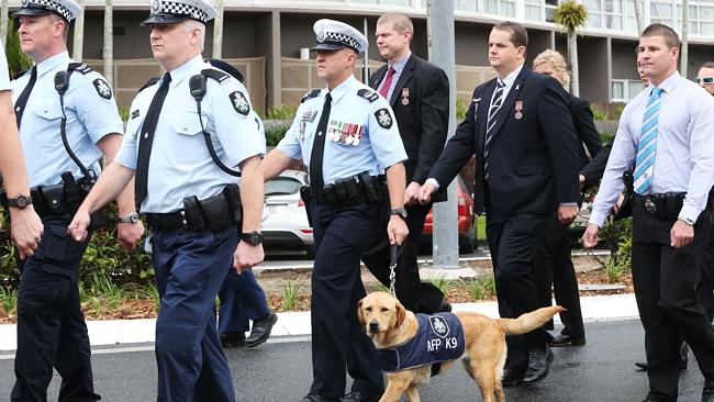 http://www.cairnspost.com.au/lifestyle/queensland-police-service-remembers-fallen-colleagues-during-cairns-march/story-fnjpuwet-1227074837676 RESPECT: Cairns police march down the Esplanade and towards St John's Anglican church to mark National Police Remembrance Day. The Federal Police canine squad participated in the march. Picture: Brendan Radke.