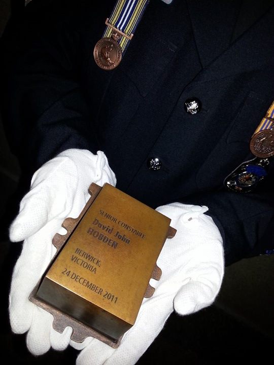 https://www.facebook.com/pages/National-Police-Memorial-Australia/48162388980 The touchstone of Victoria Police Senior Constable David John Hobden left the manufacturer in Melbourne this morning. Under AFP Federal Agent escort, the touchstone has just been handed over to NSW Police - Monaro LAC Commander, where it will be blessed at their dawn service at Queanbeyan Police Station tomorrow morning. The touchstone will then be installed into the National Police Memorial ahead of the national service tomorrow evening. We will remember.