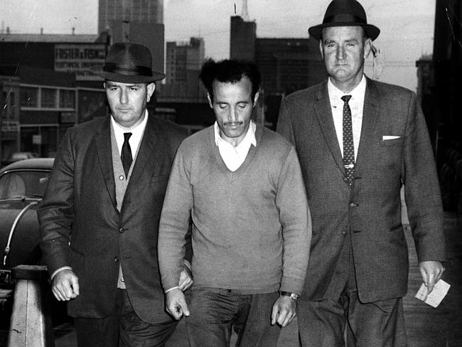 http://www.dailytelegraph.com.au/news/the-mutilator-dead-at-90-william-macdonald-who-cut-off-victims-genitalia-was-nsws-longest-serving-prisoner/story-fni0cx4q-1227353461842 Detective sergeants James Black and Jack Ford bring William McDonald to police headquarters in Russell Street, Melbourne, after his arrest.