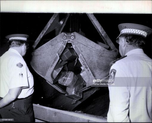 Leon BOWRA. L to R Sgt, Leon Bowra and Inspector Max Mathew, keep a close watch on the proceedings as the hemp drops into the furnace.<br /> Police today burnt 1.5 tonnes of Indian Hemp at the Waverly Tip, Botany Rd, Waterloo.<br /> The hemp had a street value of $2,000,000, and all except 5 plastic bags of the hemp was from one drug raid.<br /> April 7, 1982. (Photo by Pearce/Fairfax Media via Getty Images).