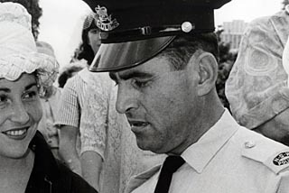 Bill Espie reading his Queen's Commendation for Brave Conduct. 