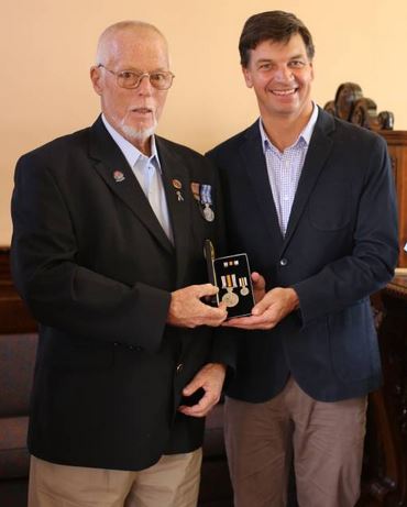 Bob MUNDAY on Friday 22 January 2016 receiving his National Police Service medals from Angus Taylor MP 2 weeks to the day of this presentation, he died.