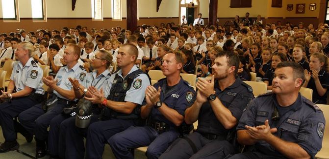THANKS: Port Stephens police officers at Newcastle Grammar School thank students for their poems dedicated to their late colleague, Sergeant Geoffrey Richardson.