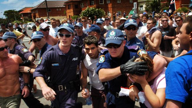 The couple were rushed to safety behind police lines. Picture: Craig Greenhill