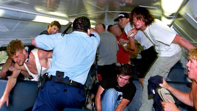 Suddenly Sergeant Craig Campbell rushed into the carriage and beat the attackers back with a baton. Picture: Craig Greenhill