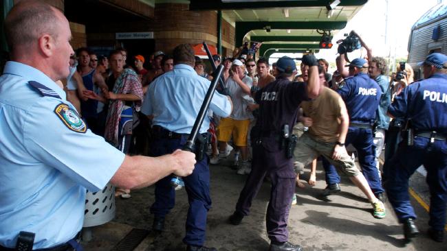 Police hold back the crowds. Picture: Craig Greenhill