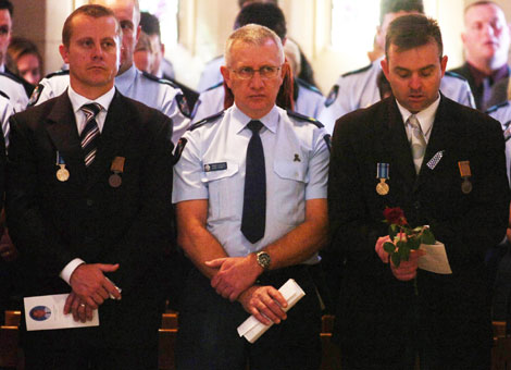 Ferny Grove Police station officers who worked with Constable Brett Andrew Irwin during the officer's funeral at the St Stephens Cathedral. Picture: AAP/Tony Phillips
