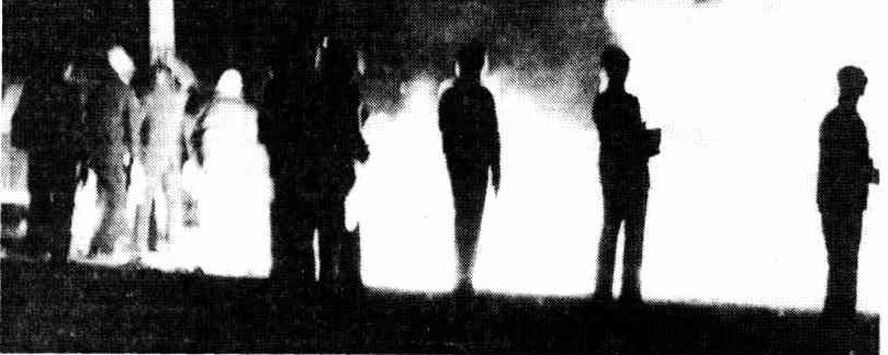 http://trove.nla.gov.au/newspaper/article/116377063/12938147 Silhouetted by flames, police in riot gear stand guard outside the police compound at Mount Panorama, near Bathurst, during the riot on Saturday night.