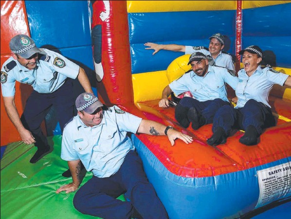 http://newslocal.newspaperdirect.com/epaper/viewer.aspx Senior Constable Jay Stewart and colleagues Graham Smith, Mick Errickson, Karen Bertram and Steve Bancroft warming up for their Guinness Book of World Records attempt for continuous jumping on a jumping castle.