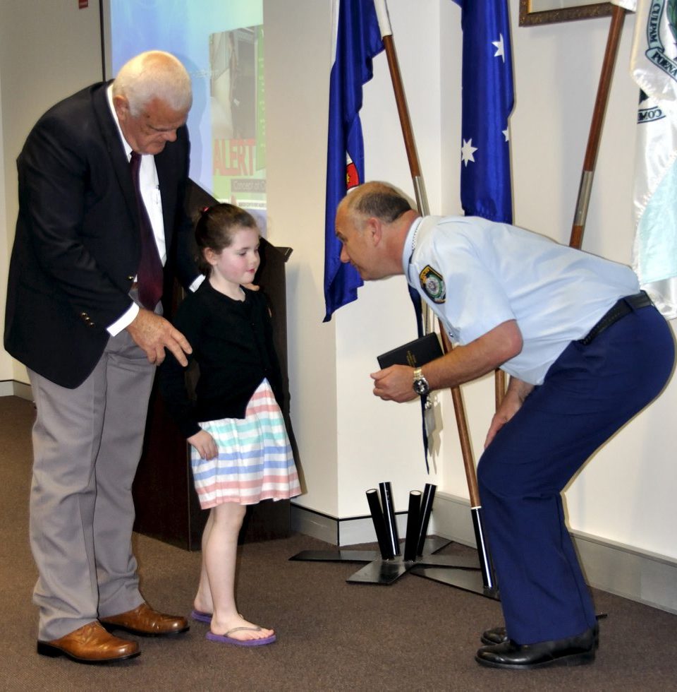 Eoin PETERS & the Granddaughter of Gail BROOKS - Rubie, accepting Gail's Medal.