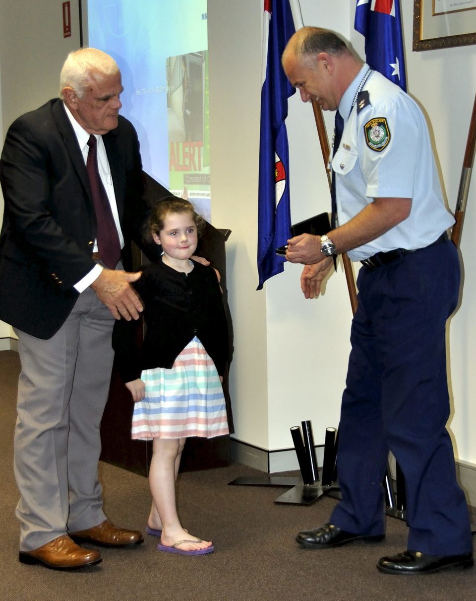 Eoin PETERS & the Granddaughter of Gail BROOKS - Rubie, accepting Gail's Medal.