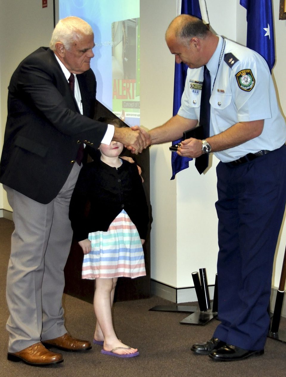 Eoin PETERS & the Granddaughter of Gail BROOKS - Rubie, accepting Gail's Medal.