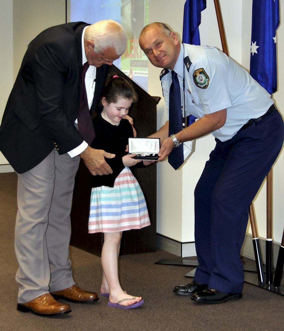 Eoin PETERS & the Granddaughter of Gail BROOKS - Rubie, accepting Gail's Medal.