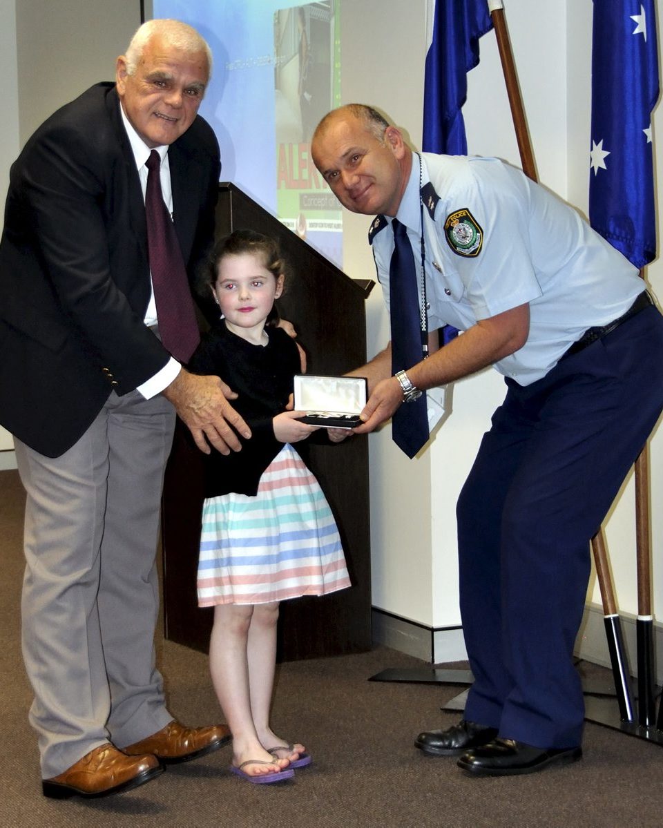 Eoin PETERS & the Granddaughter of Gail BROOKS - Rubie, accepting Gail's Medal.