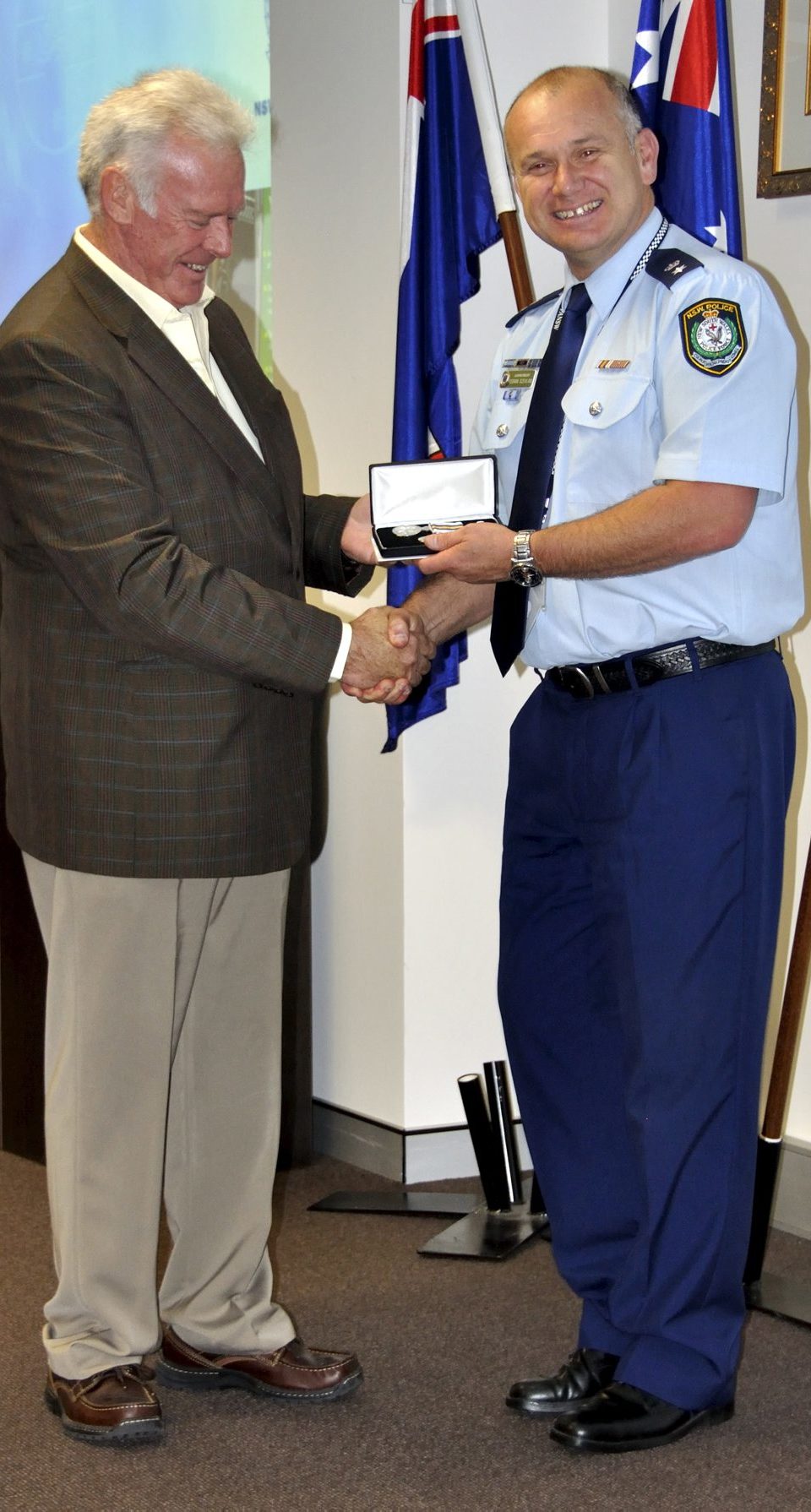 Alan BLAKE receiving his Medal.