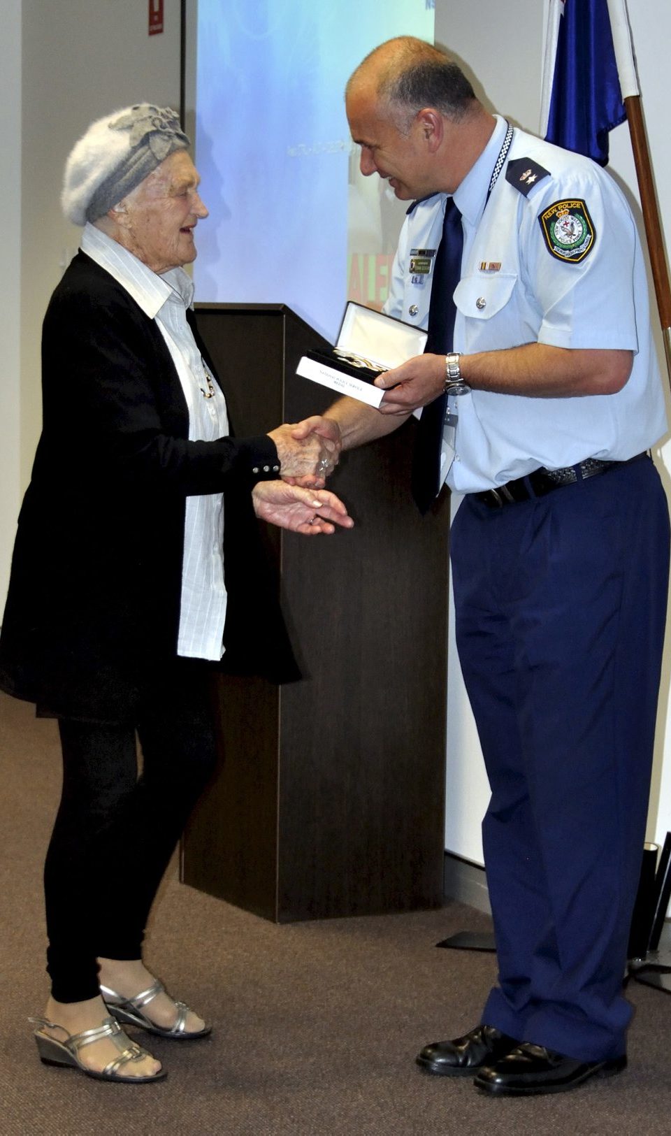 Audrey EVANS collecting the Medal for James EVANS.