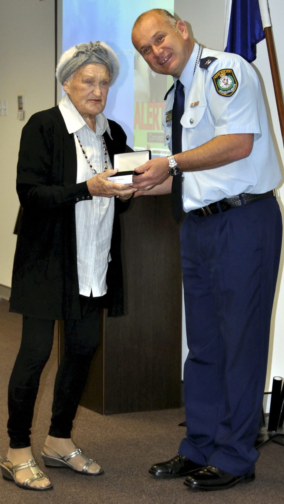 Audrey EVANS collecting the Medal for James EVANS.