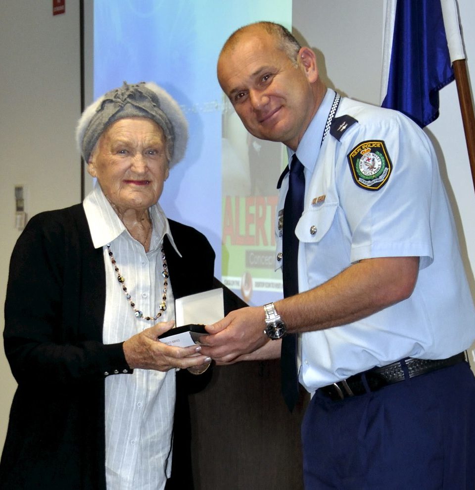 Audrey EVANS collecting the Medal for James EVANS.