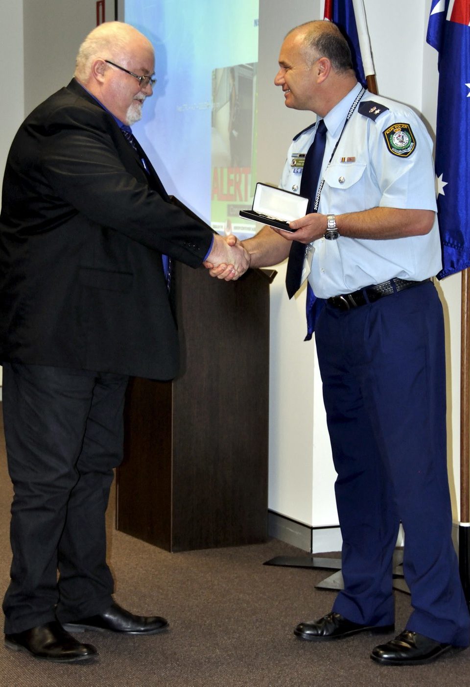 John TIERNEY accepting his Medal.