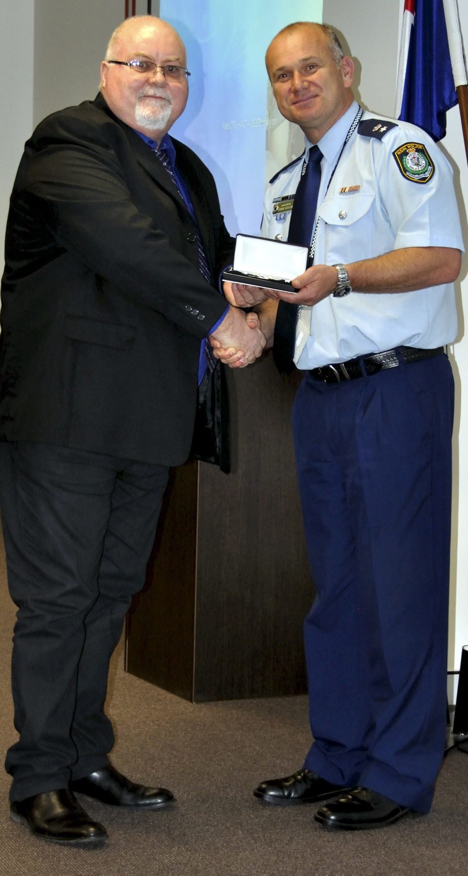 John TIERNEY accepting his Medal.