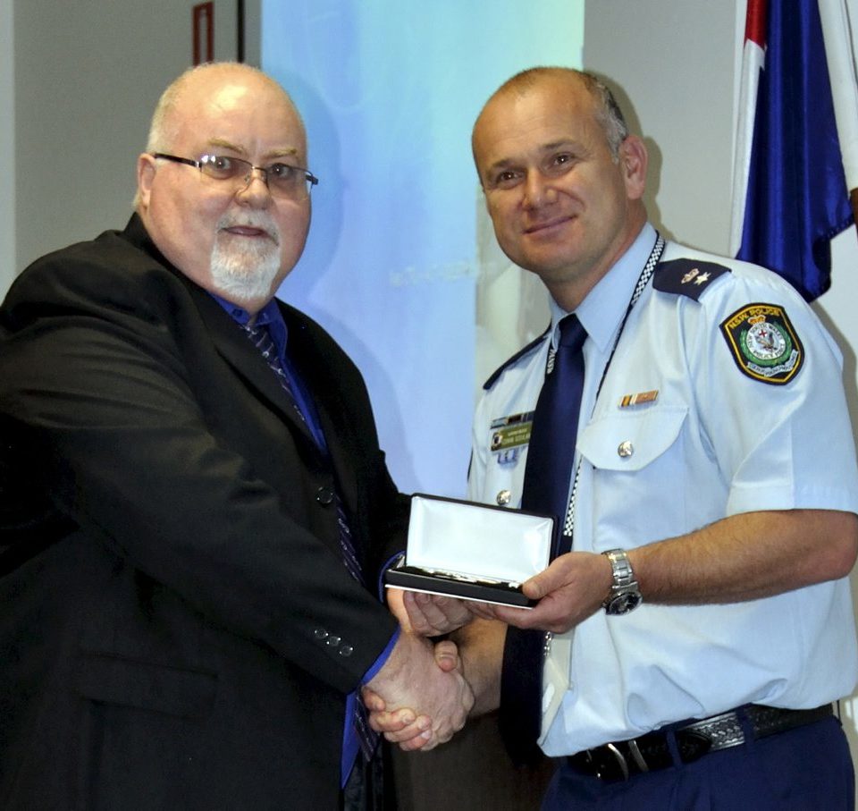 John TIERNEY accepting his Medal.
