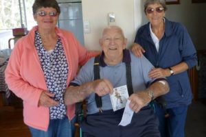 BIRTHDAY BOY: Sue Cotterill and Wendy Dunn help long-time Tathra resident Fred Pitchford celebrate his 92nd birthday on October 28 with family and friends.