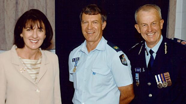 http://www.smh.com.au/national/from-community-pillar-to-recluse-missing-cops-downward-spiral-20091001-gf4h Senior Sergeant Mick Isles (centre) with former state Police Minister Judy Spence and Queensland Police Commissioner Bob Atkinson.