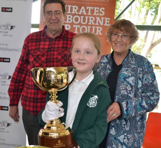 http://www.southcoastregister.com.au/story/3327279 CUP: Maddy Jackson with her grandparents Dee and Dennis Matts at the 2015 Emirates Melbourne Cup visit to Terara Public.
