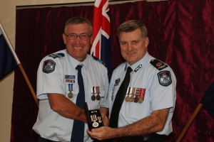 https://mypolice.qld.gov.au/gladstone/2014/03/13/gladstone-patrol-group-honours-awards-ceremony/<br /> Sergeant Owen Harms OIC Miriam Vale receives his award from the A
