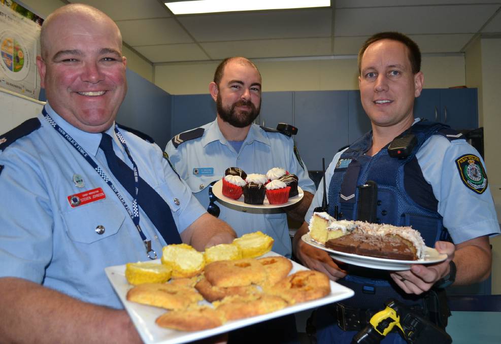 https://www.southcoastregister.com.au/story/3930477/cops-turn-into-cooks-for-charity/ SCRUMPTIOUS DELIGHTS: Shoalhaven LAC Chief Inspector Steve Johnson, Senior Constable Brian Balding and Constable Simon French with some of the delights from Thursday’s morning tea.