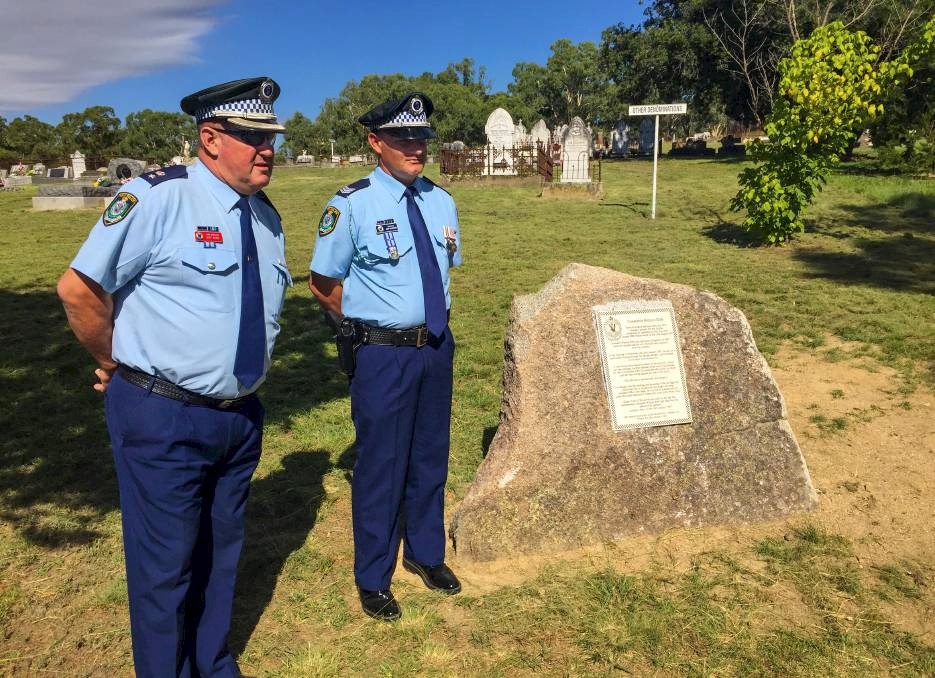 Memorial service: Oxley Acting Superintendent Jeff Budd lays a wreath at the unveiling of the plaque at the Bendemeer cemetery. Photos: Breanna Chillingworth<br /> Memorial unveiled: Oxley Acting Superintendent Jeff Budd with Sergeant Josh McKenzie in Bendemeer.<br />