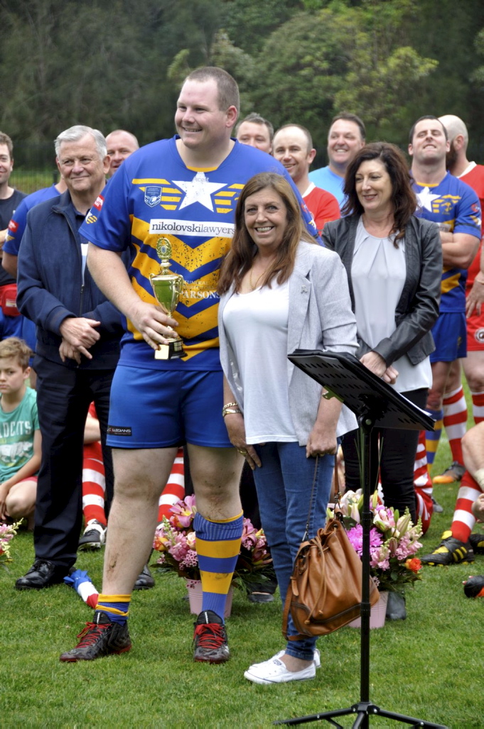 Amanda presenting the Col Stevenson Trophy to ? at the 2017 Illawarra Police Memorial footy game.
