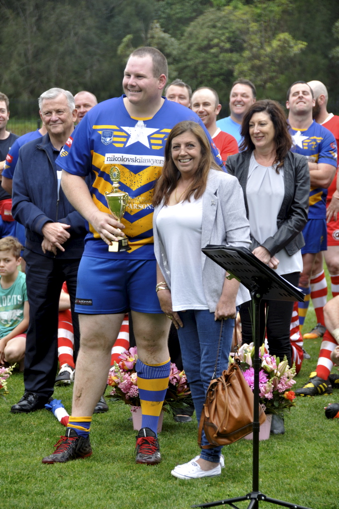 Amanda presenting the Col Stevenson Trophy to ? at the 2017 Illawarra Police Memorial footy game.