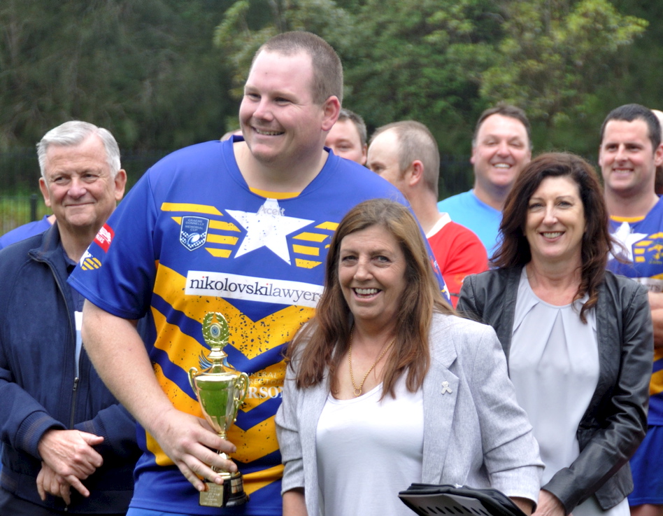 Amanda presenting the Col Stevenson Trophy to ? at the 2017 Illawarra Police Memorial footy game. Retired Commissioner of NSW Police - Ken Moroney to left. Police Widow - Kerri Donnelly to the right