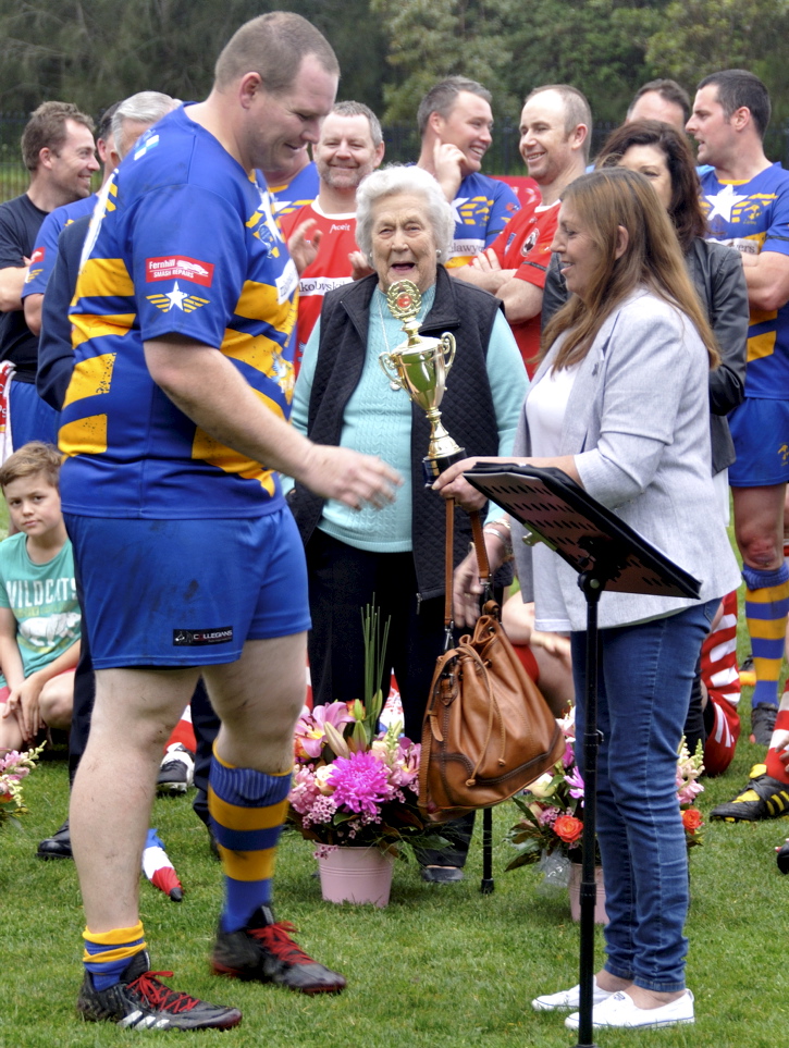 Amanda presenting the Col Stevenson Trophy to ? at the 2017 Illawarra Police Memorial footy game.