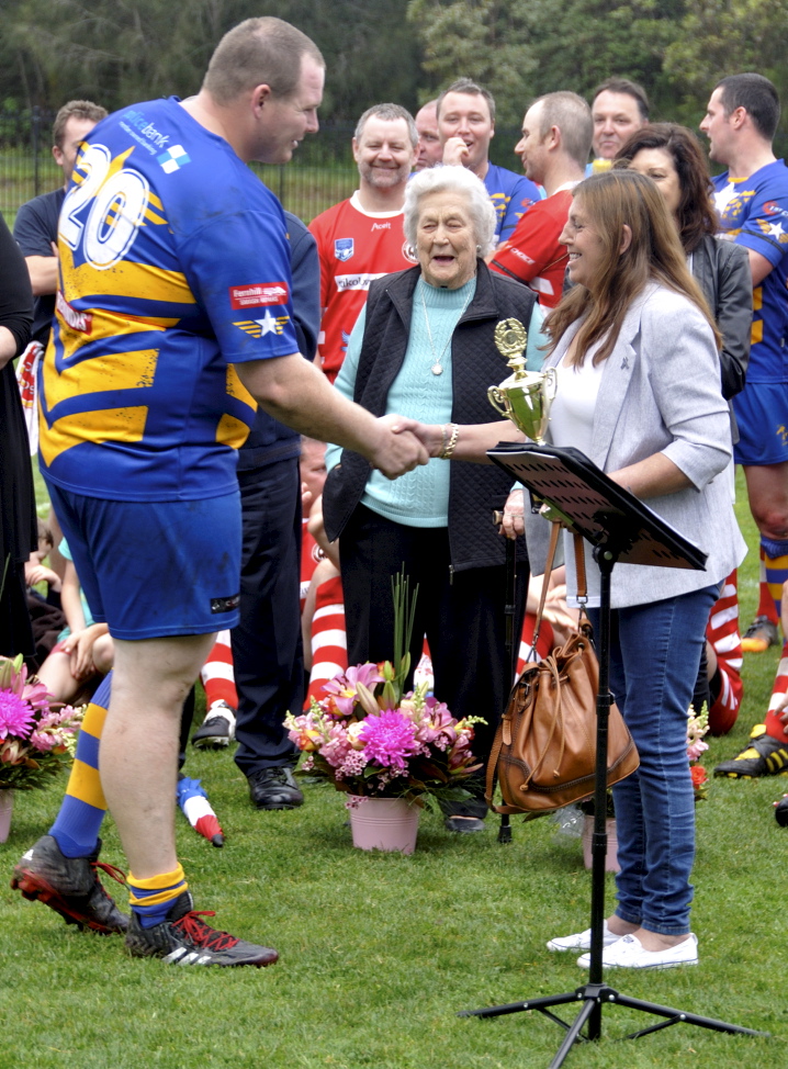 Amanda presenting the Col Stevenson Trophy to ? at the 2017 Illawarra Police Memorial footy game.