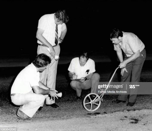 Brian George BANISTER AKA Doggy - standing & holding a torch