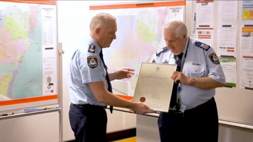 NSW Police Commissioner, Mick FULLER # 24552 presenting the Certificate of Service to retiring Senior Sergeant John THOMPSON # 10718 at the Planning Unit, Parramatta, on Friday 15 May 2020.