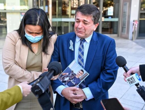 Chief Inspector David Vidal and his sons fiancée Jessica Loh outside the court on Monday.Credit:Nick Moir